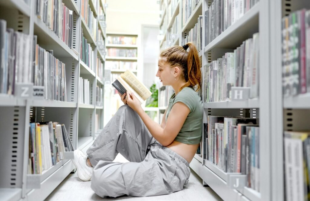 Pretty girl teenager in library